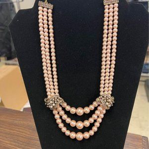 New in box Heidi Daus pink pearl necklace and earring set.  Signed pieces